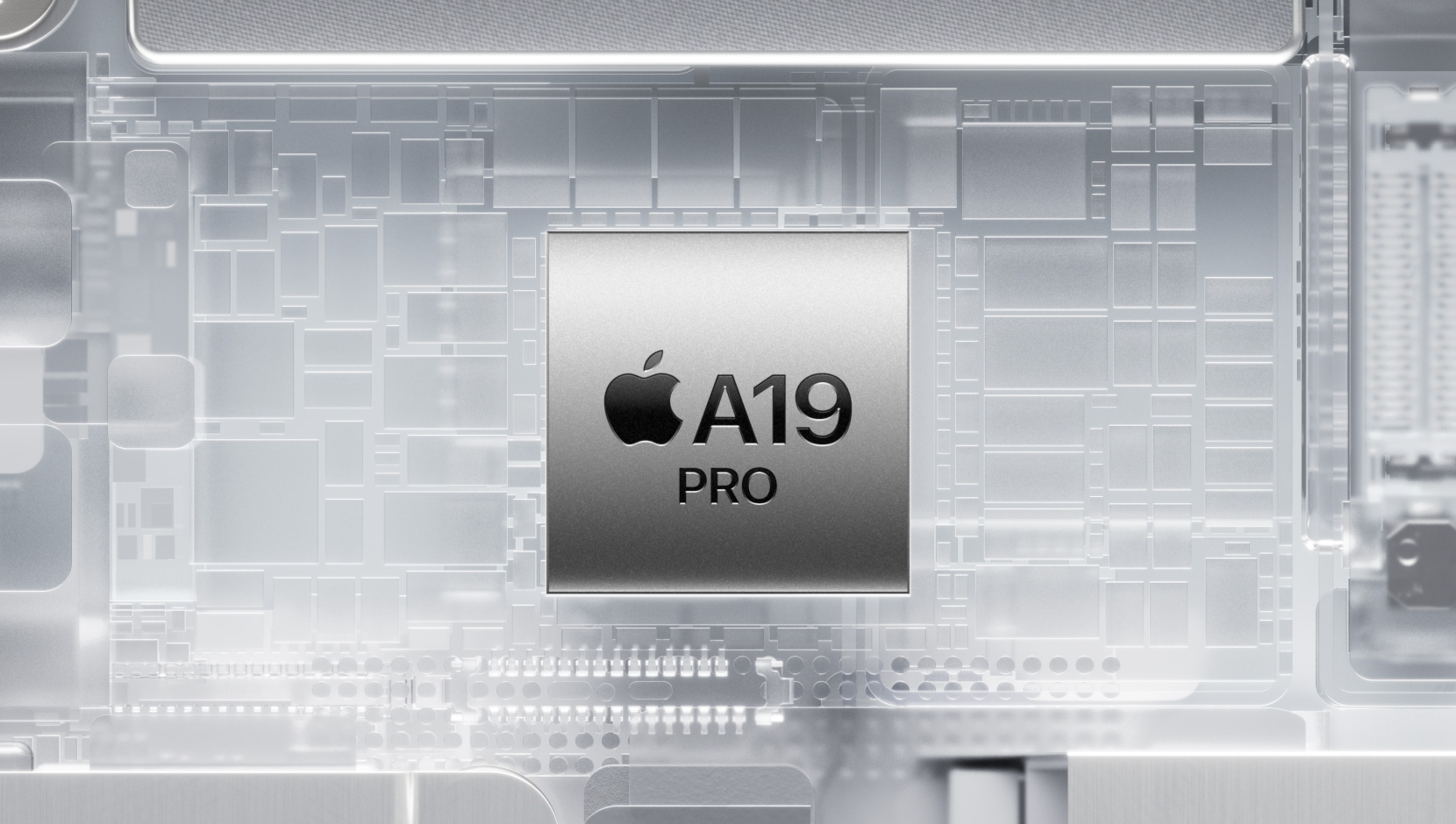 A19 Pro-chip som omges av lysande inre iPhone-komponenter