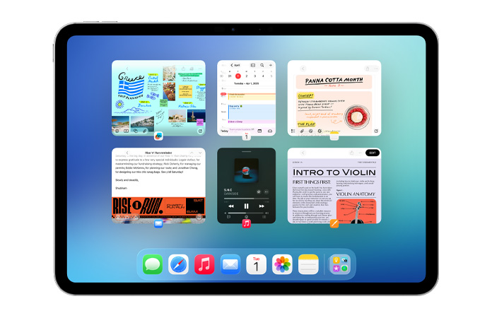 iPad i liggande läge med sex öppna fönster på två rader på skärmen, bland andra apparna Kalender, Anteckningar, Apple Music och Safari